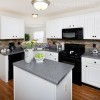 white kitchen cabinets black appliances