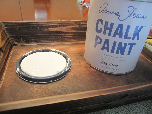 A can of Annie Sloan Chalk Paint on the table beside the tray.