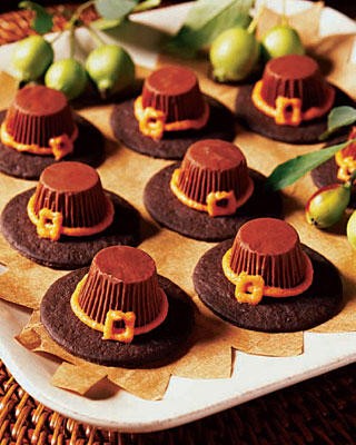 Candy chocolate pilgrim hats on a plate.