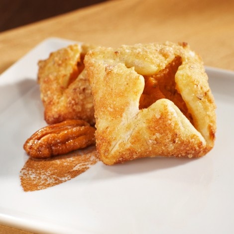 Sweet potato puffs on a white plate.