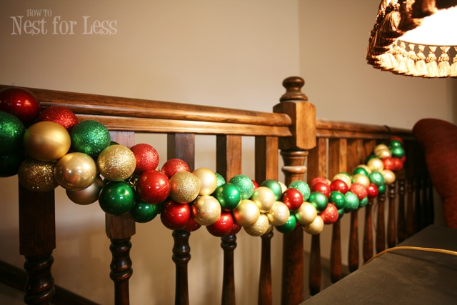 The garland strung together and tied to the staircase bannister.