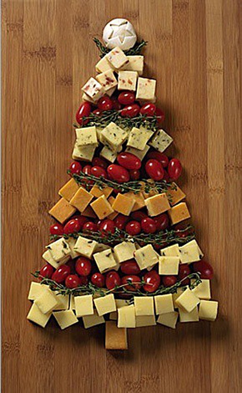 A veggie and cheese tray in the shape of a Christmas tree.