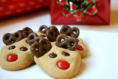 Reindeer cookies with chocolate covered pretzels as ears.