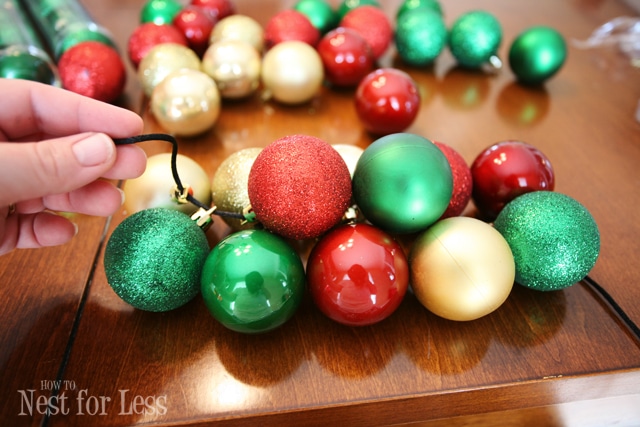 The ornaments all strung together with the black cording.