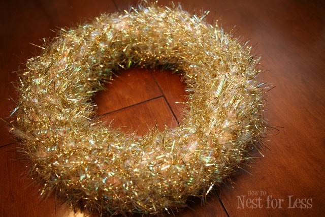 The gold tinsel all around the wreath, sparkly.