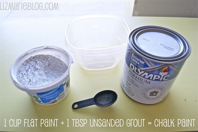A can of paint, unsanded grout and a measuring spoon on the counter.