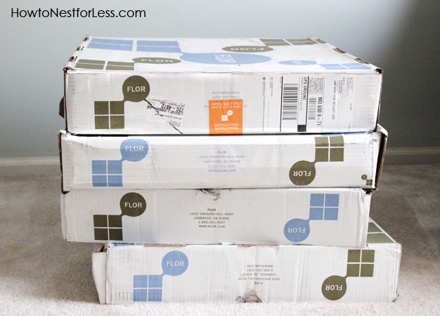 Boxes of the Flor tiles stacked on top of each other.