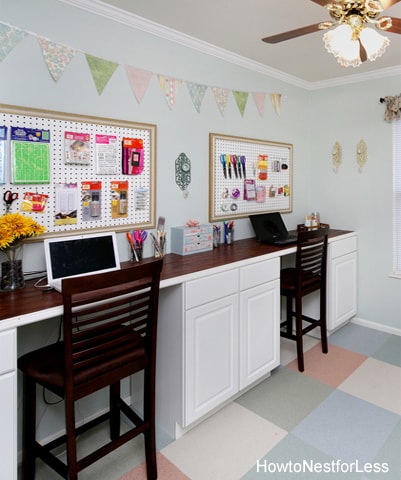 White desk cabinets and wood brown top.