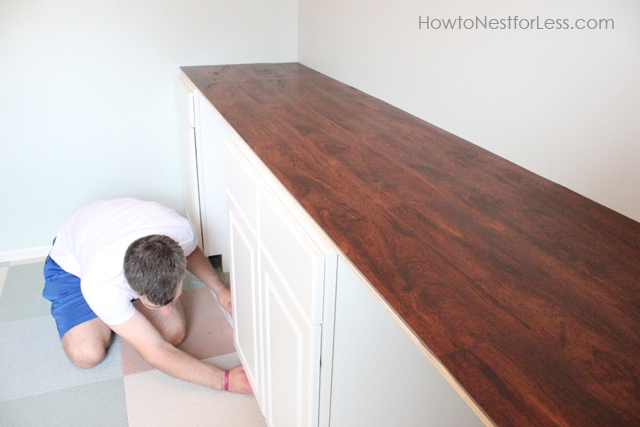 The brown laminate floor all installed on top of the desk.