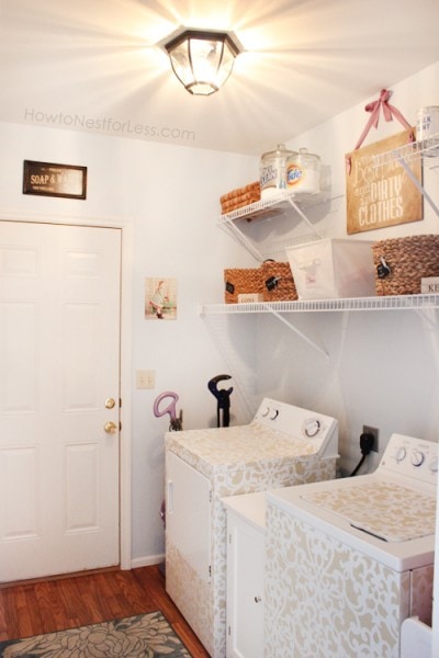 Stenciled washer and dryer in painted laundry room.