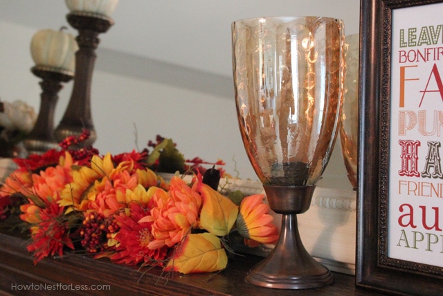 Red gold and yellow flowers on the mantel.