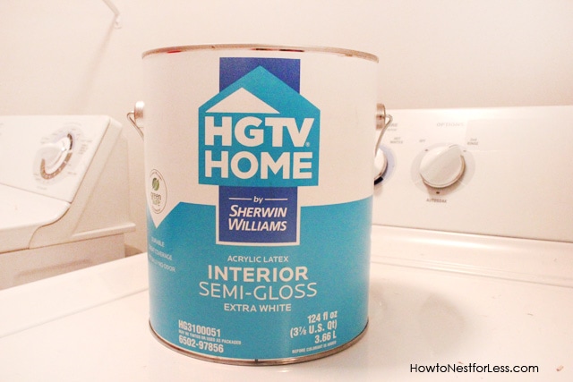 A can of interior semi glass HGTV paint on the washing machine.