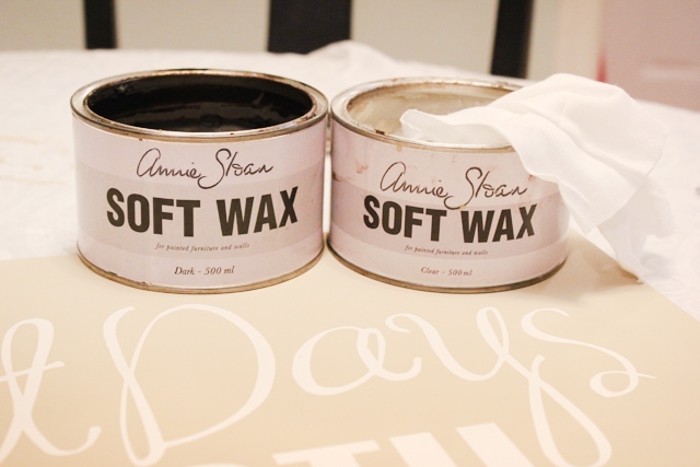 Annie Sloan soft wax opened and by the sign.