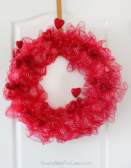 Red vibrant wreath with hearts on it.