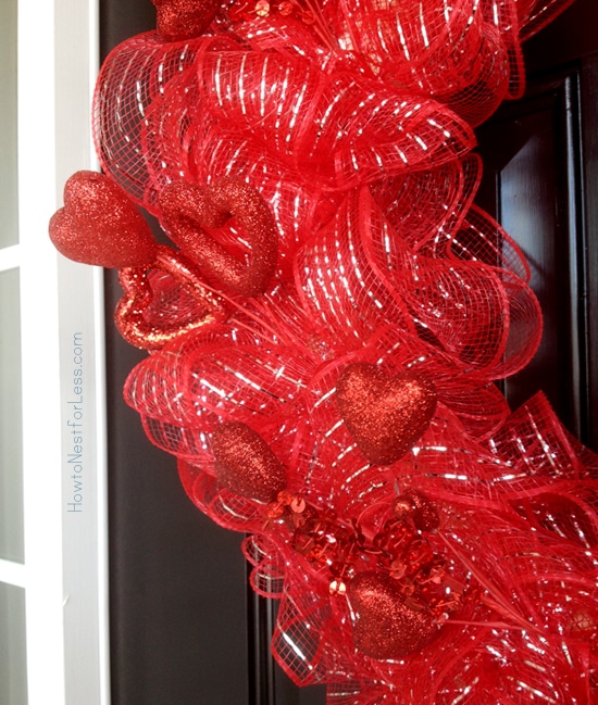 Up close picture of the red wreath on the door.
