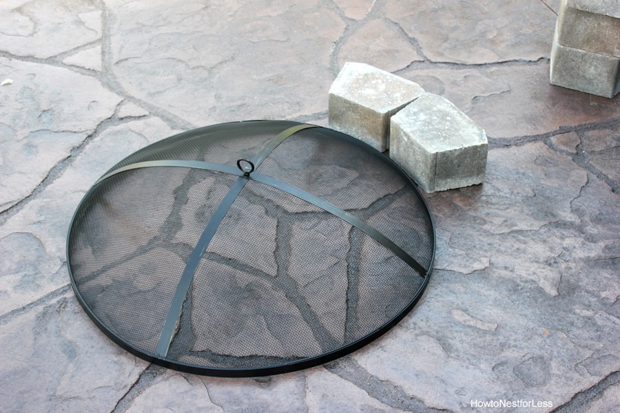 Laying the stones in a circle on the patio.
