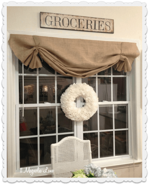 Burlap valance on a large window.