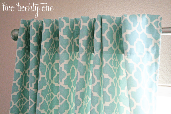 Green and white patterned curtains.