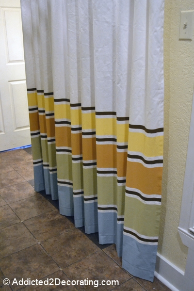 Painted striped curtains with blue, green, orange and yellow.