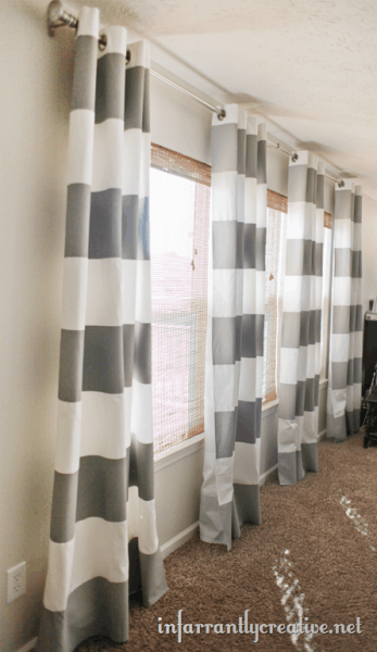 Wide striped gray and white curtains in the family room.