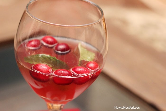 Jingle juice christmas drink with a mint leaf floating inside it.