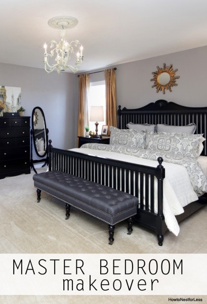 Master bedroom with chandelier above the bed.