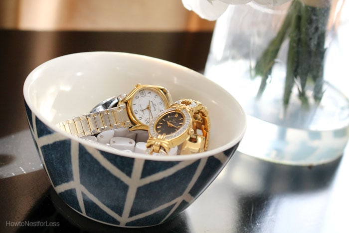 Gold watches on nightstand.