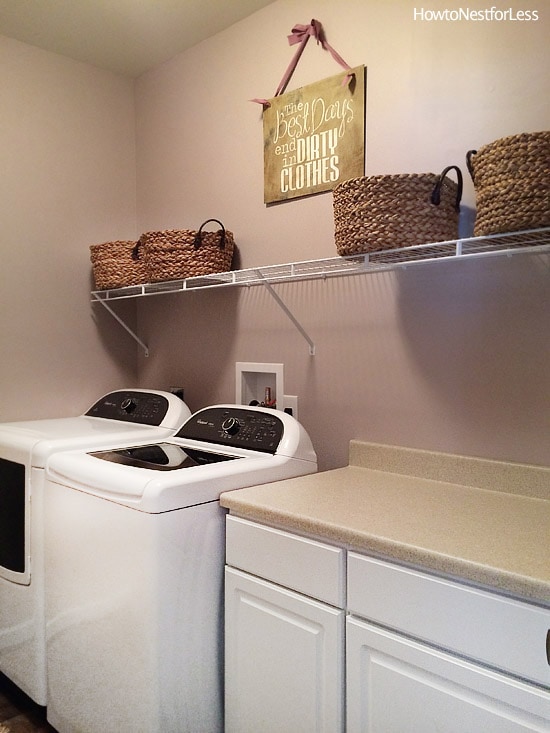 laundry room shelves and sign