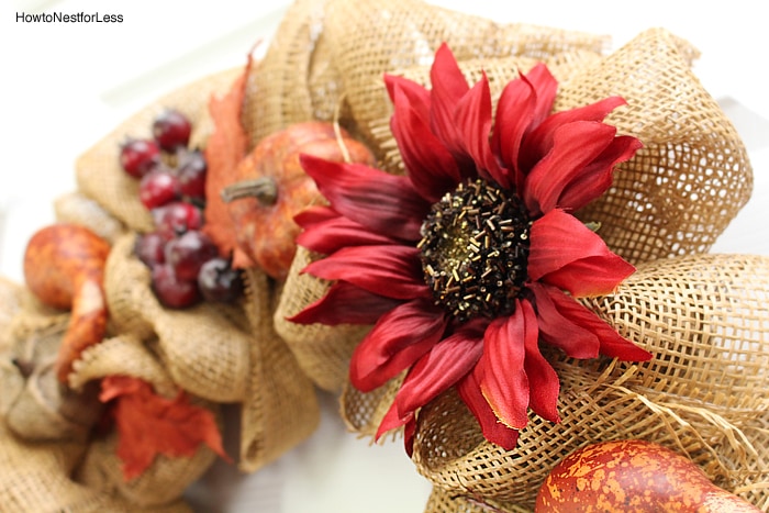 Red faux flowers on the wreath.