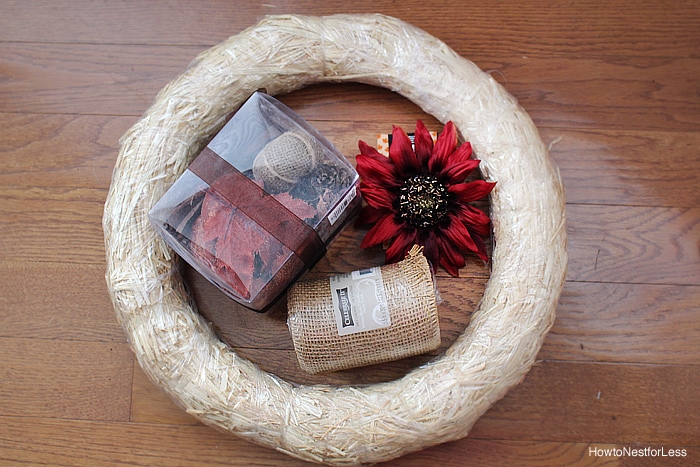 Fall burlap wreath supplies on the floor.