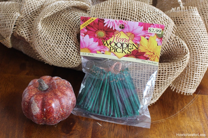 Wooden floral picks beside the wreath.