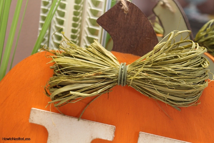 Fall DIY monogram pumpkin with hot glued bow.