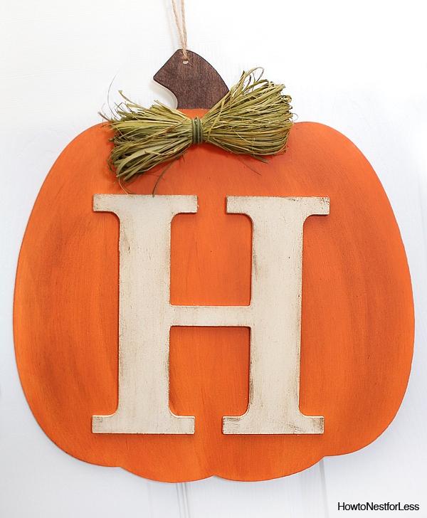 Orange pumpkin with the H monogram in white on it.