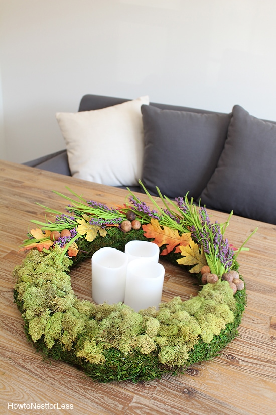 Moss centrepiece on wooden coffee table.