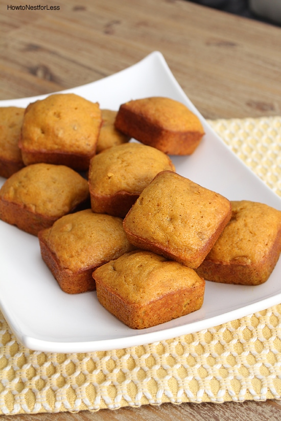 Little square pumpkin cakes on a white plate.