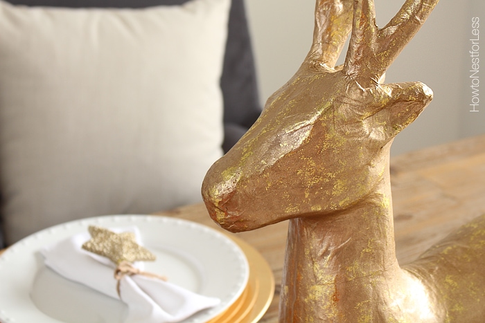 The face of the gold deer on the table.