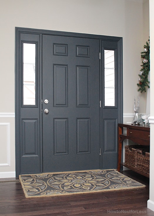 Interior front door painted and multi coloured rug.