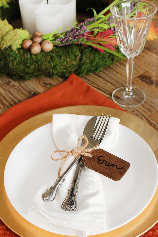 Thanksgiving napkin ring on the plate with a fork and knife.