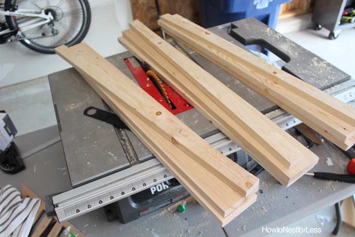 Cutting the wood into pieces with a table saw.