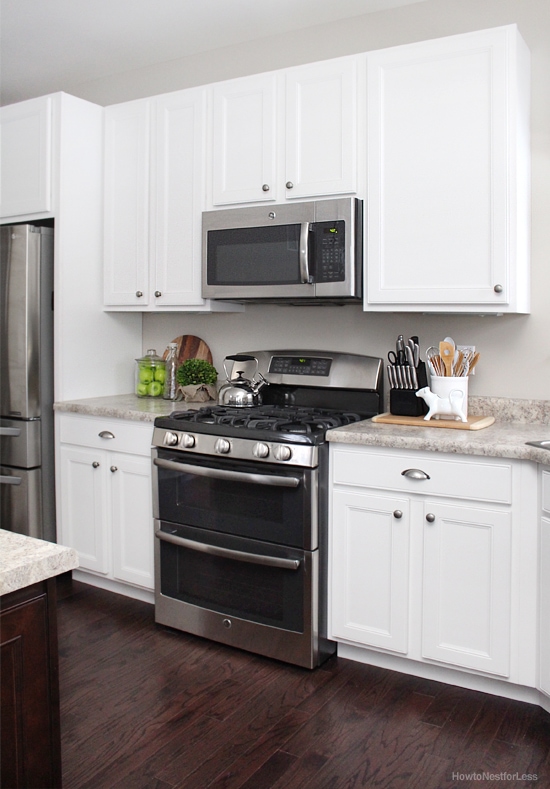 white kitchen cabinets dark flooring