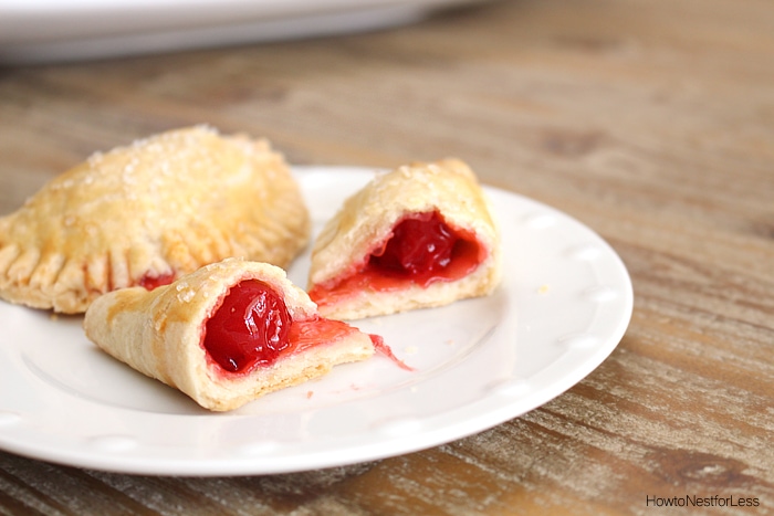 One of the pies cut open with the cherry filling.