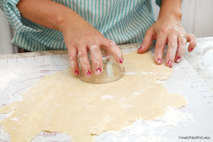 Cutting out the dough into circles.