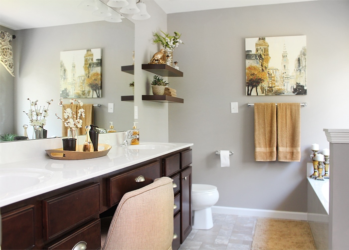 Wooden shelves in master bathroom beside the vanity.