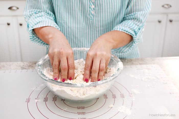 Mixing the dough by hand in a bowl.