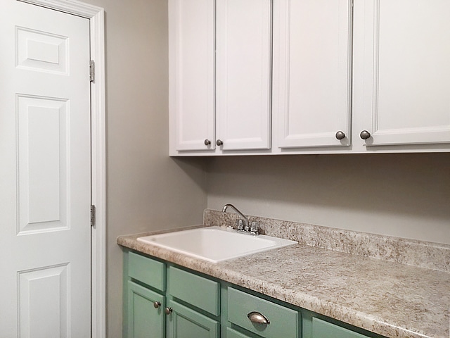 laundry room painted cabinets