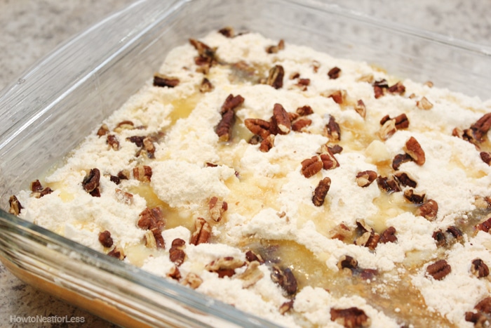 The cake batter in a clear glass baking pan.