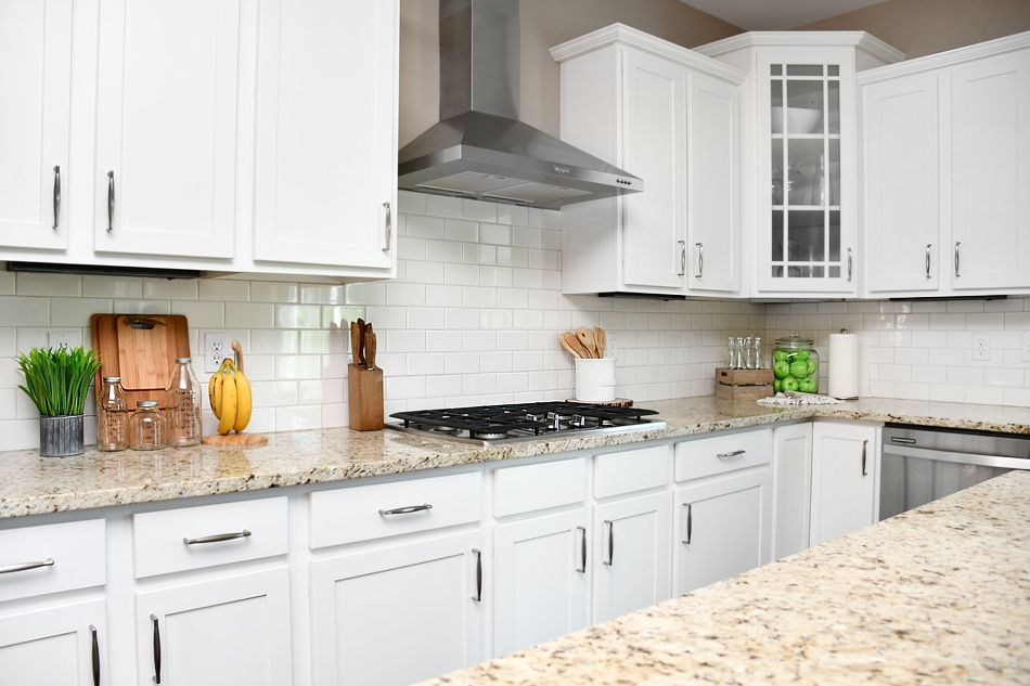 A stainless steel fan above the stove in the kitchen.