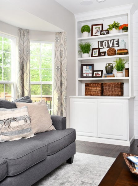 Family Room Makeover with White Built Ins and Charcoal Couches