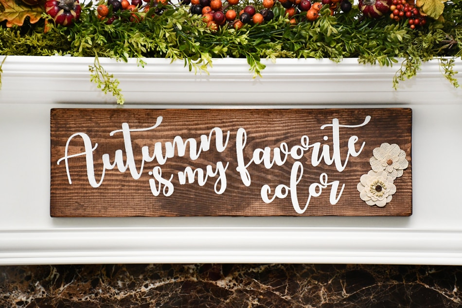 Autumn is my favorite color wood sign hanging above fireplace.