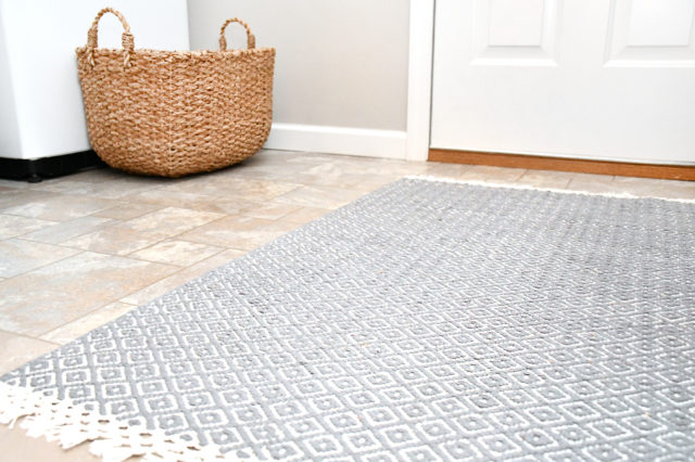 laundry room rug and seagrass basket